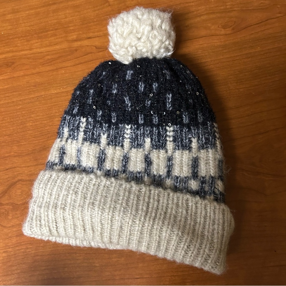 Fleece lined sequence winter hat with Pom Pom.